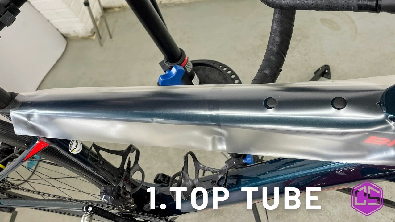 Clear frame protection on bike's top tube, ensuring durability and style.